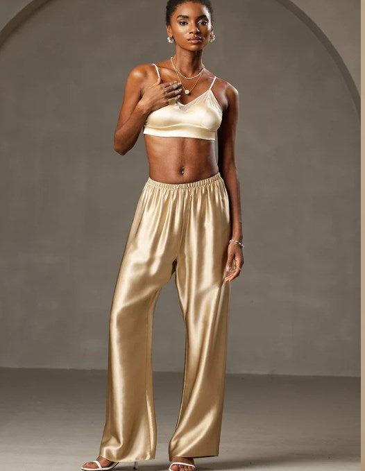 A split image showing casual dusty rose silk pants: a close-up on the drawstring waist on the left, and a full outfit with a white lace bralette on the right