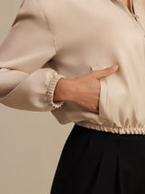 White reversible mulberry silk jacket with stand collar, zipper, and pockets