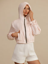 Women's cropped silk hooded jacket with pockets, zipper, elastic waist, and ruffled cuffs