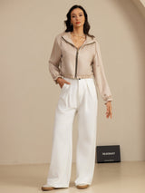 Blue silk cropped hooded jacket with zipper, pockets, and ruffled cuffs