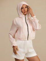 White cropped silk hooded jacket with zipper, pockets, and ruffled cuffs