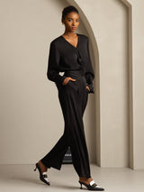 Green silk V-neck blouse with long sleeves, pleated front and 3D rose detail