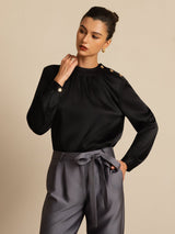 Woman in 19Momme silk gathered neck blouse with long sleeves and button detail