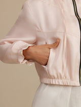 Women’s cropped silk hooded jacket with pockets, ruffled cuffs and drawstring waist