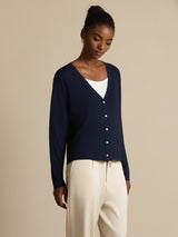 Women's white silk V-neck cardigan with long sleeves and button front