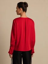 Light green 19 momme silk blouse with V-neck, long sleeves, pleats and 3D rose detail