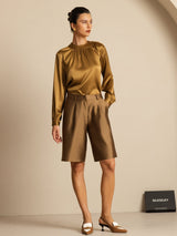 Women’s silk blouse with gathered neck, long sleeves, and button detail