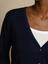 White silk V-neck cardigan with long sleeves and button front